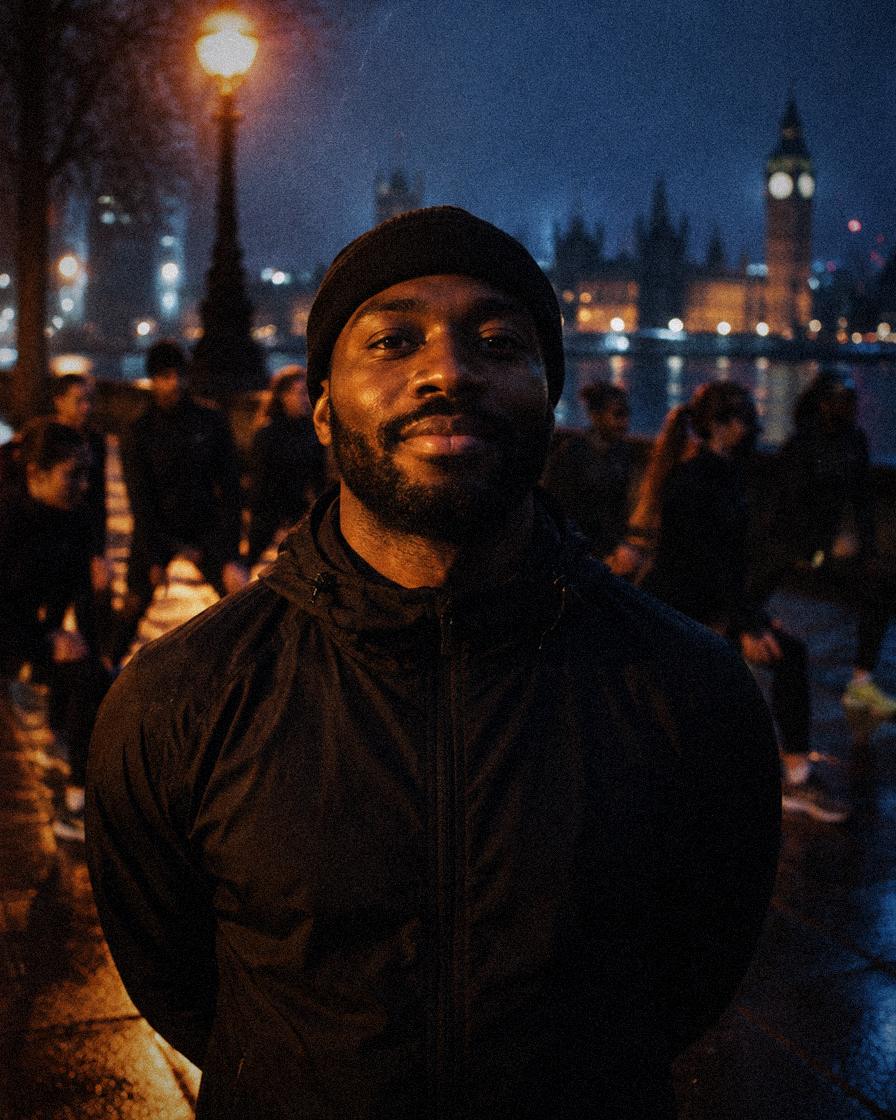 A run club captain on the South Bank with his club warming up behind him